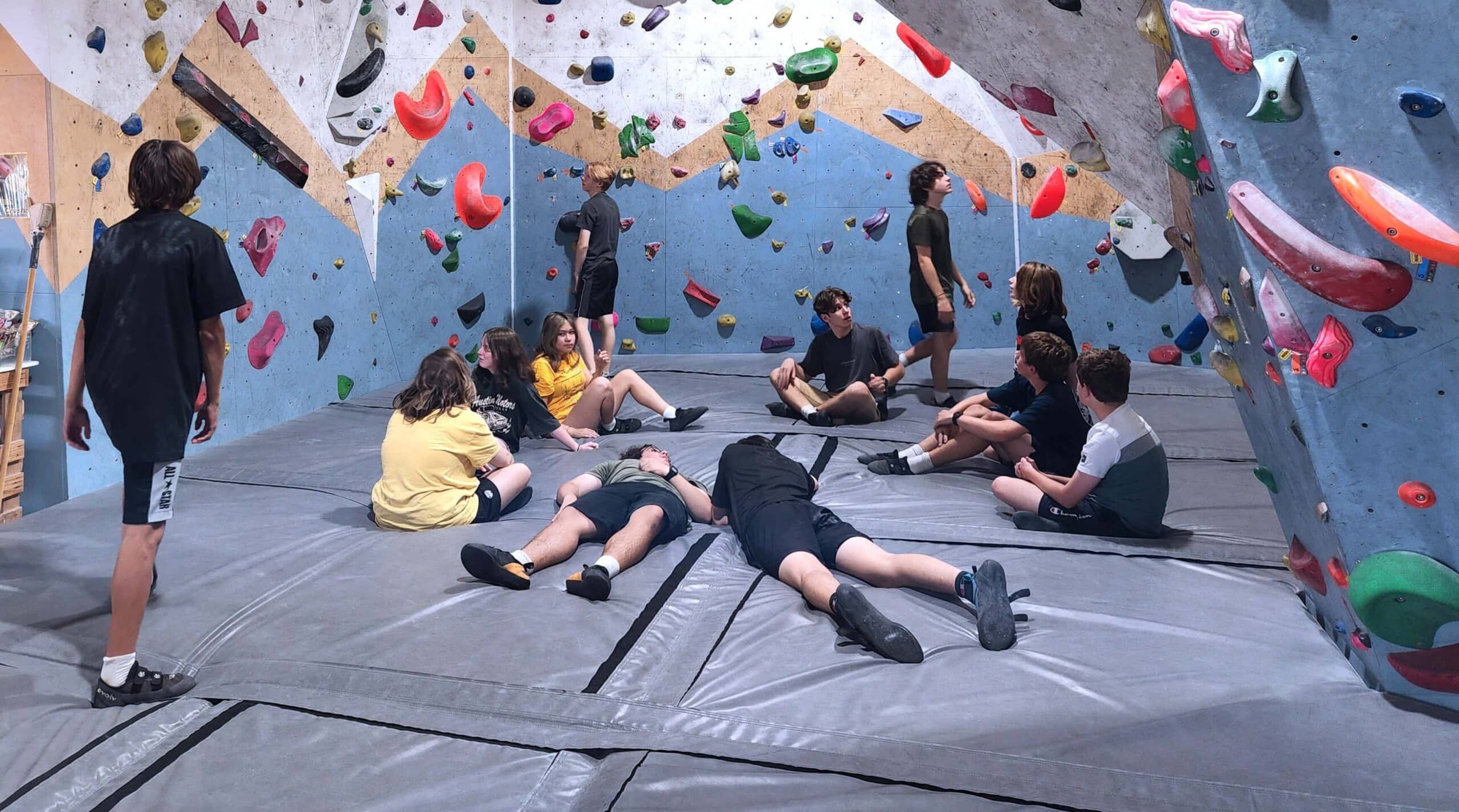 Group of friends climbing at Wall Walkers Bouldering during a group event